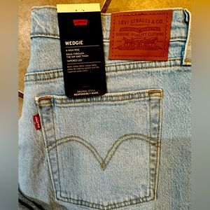 Levis Wedgie a high rise snug through the hip and thigh tapered leg